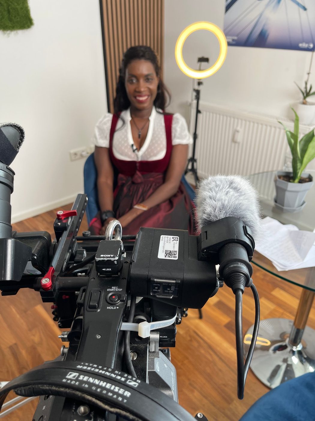 Sadia De Kiden filming with a BR camera crew